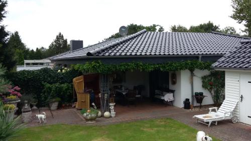 Maison de vacances Seeperle 1, Ferienhaus am Leuchtturm mit traumhaftem Garten 4 Zum Leuchtturm Ording