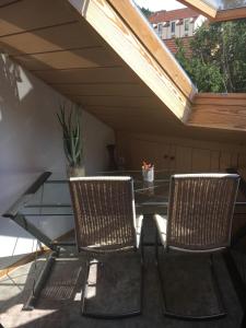 Dachgeschoss in einem Reihenhaus (mit gemeinschaftlichen Räumen)