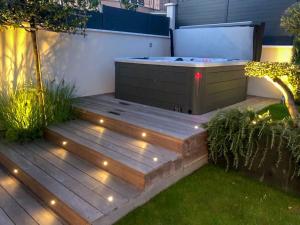 EXIGEHOME - Chambre d'hôte avec jacuzzi et jardin paysagé, partagé