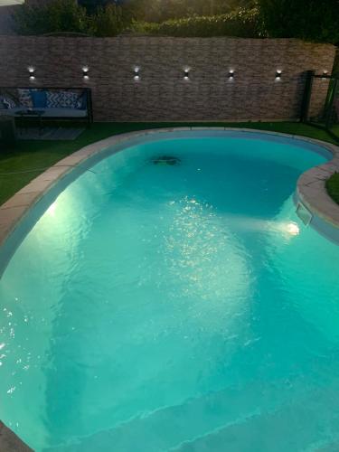 Petit appartement chez l’hôte avec piscine