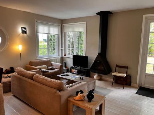 Agréable maison de ville avec cheminée et jardin