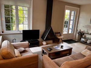 Agréable maison de ville avec cheminée et jardin